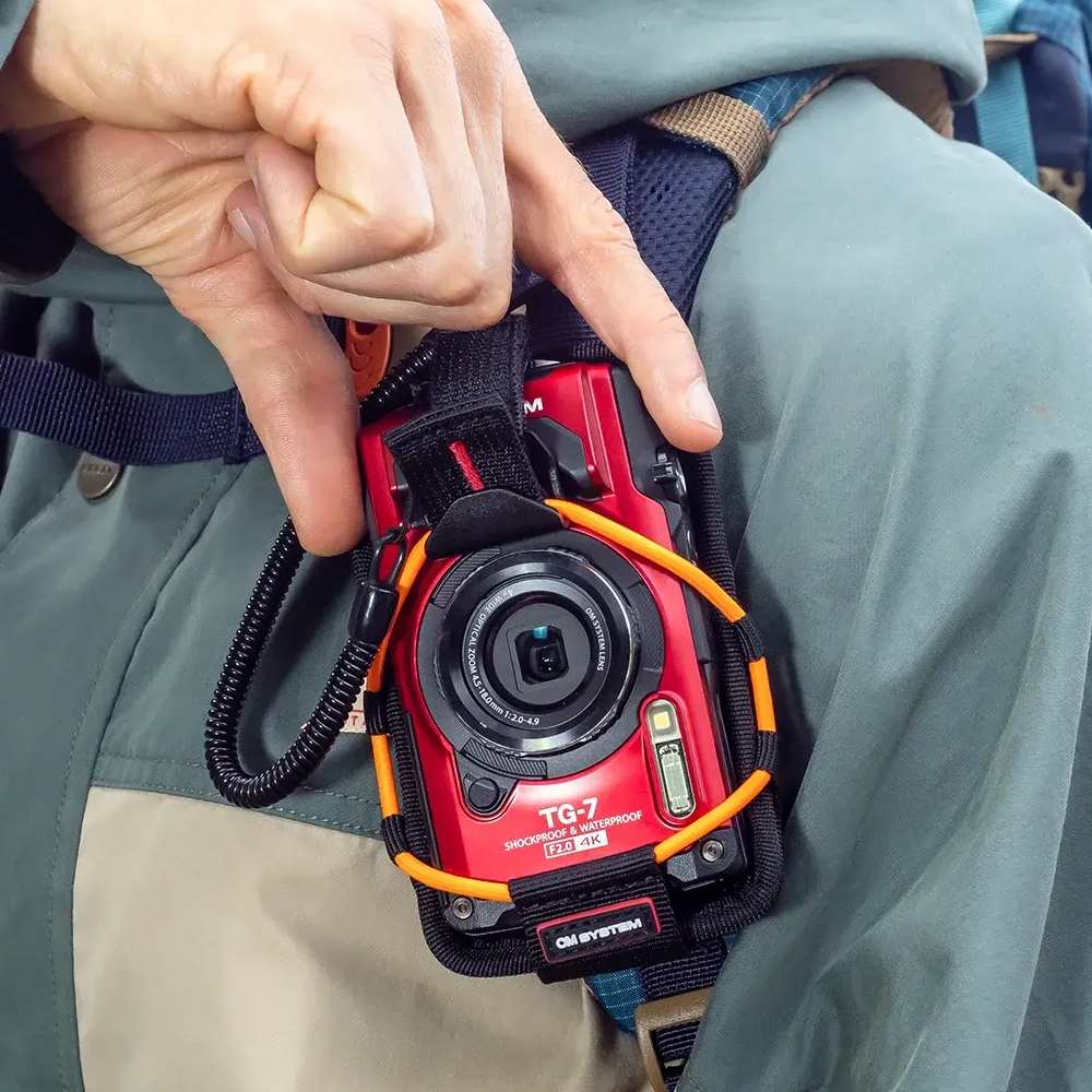 OM SYSTEM CSCH-123 sports supporto arancione per TG